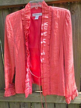 Stunning one-of-a-kind jacket in shimmering tangerine; ruffled front and cuffs